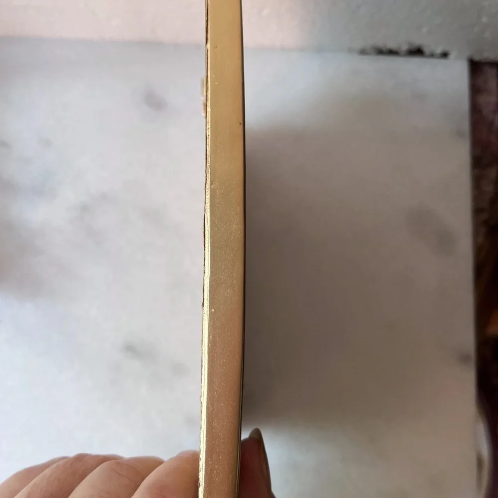 Vintage ornate gold wall mirror, accent mirror. Bow decorated frame